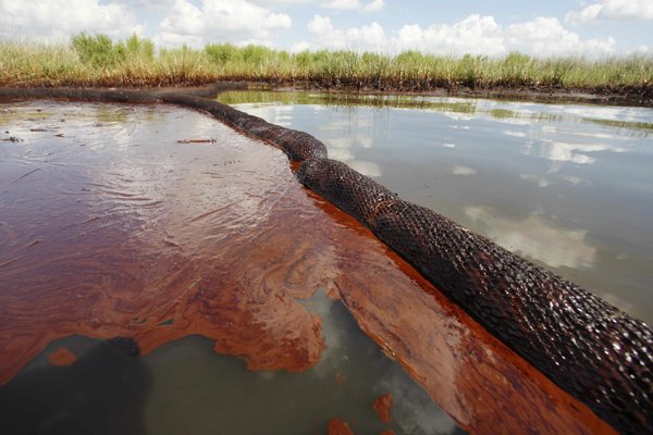 Oil from the Deepwater Horizon spill floats on the surface of the water Saturday at Bay Jimmy in Plaquemines Parish, La.