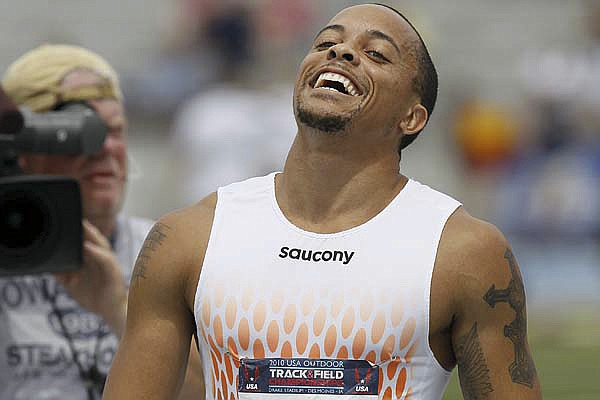  Team Saucony's Wallace Spearmon reacts after winning the men's 200 meter dash at the USA Outdoor Track and Field Championships.