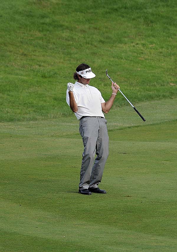 Bubba Watson celebrates after hitting his approach shot on the first playoff hole during the final round of the PGA Travelers Championship on Sunday in Cromwell, Conn. Watson won the tournament on the second playoff hole.