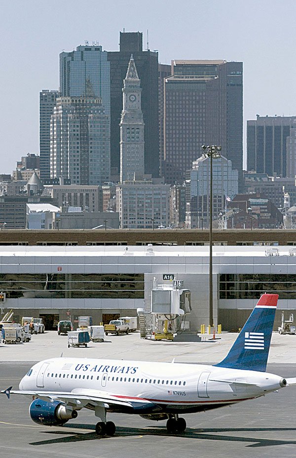 A US Airways Airbus A319-112 taxis at Logan International Airport in Boston in this file photo.