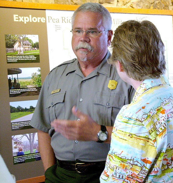 Park superintendent John Scott talks with Colonel Rebecca Jones as the unit from the U.S. Army Sustainment Command arrived at Pea Ridge National Military Park Wednesday. 