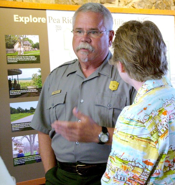 Park superintendent John Scott talks with Colonel Rebecca Jones as the unit from the U.S. Army Sustainment Command arrived at Pea Ridge National Military Park Wednesday. 