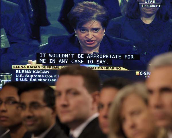 A video screen looms over the audience Wednesday as Elena Kagan continues testimony in her Senate Judiciary Committee confirmation hearings on her high-court nomination.