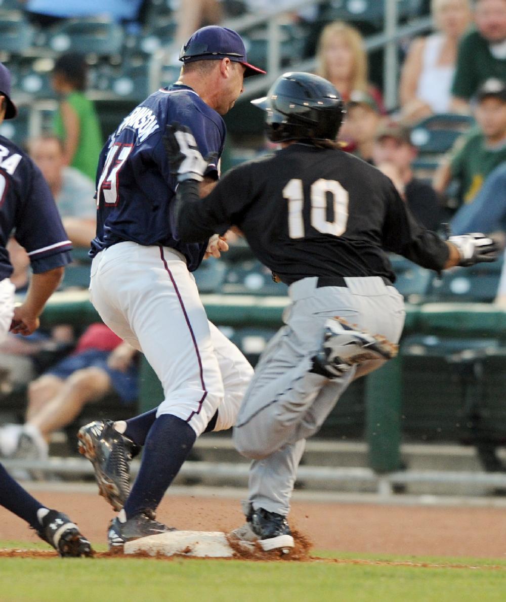 Arkansas Democrat-GazetteMICHAEL WOODS --07-01-10-- Naturals first baseman Clint Robinson forces out San Antonio baserunner Drew Cumberland at first base to end the 6th inning of Thursday nights game at Arvest Ballpark in Springdale.