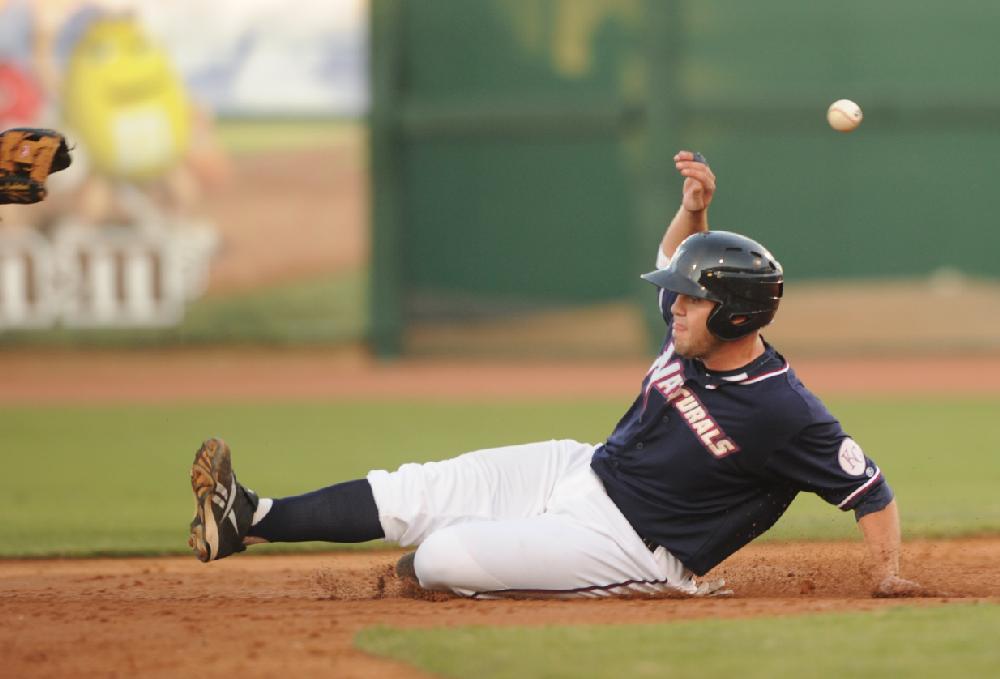Arkansas Democrat-GazetteMICHAEL WOODS --07-01-10-- Naturals baserunner Mike Moustakas slides safely into second base as San Antonio short stop Drew Cumberland takes the throw in the 3rd inning of Thursday nights game at Arvest Ballpark in Springdale.