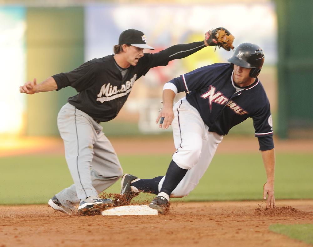 Arkansas Democrat-GazetteMICHAEL WOODS --07-01-10-- Naturals baserunner Mike Moustakas slides safely into second base as San Antonio short stop Drew Cumberland takes the throw in the 3rd inning of Thursday nights game at Arvest Ballpark in Springdale.
