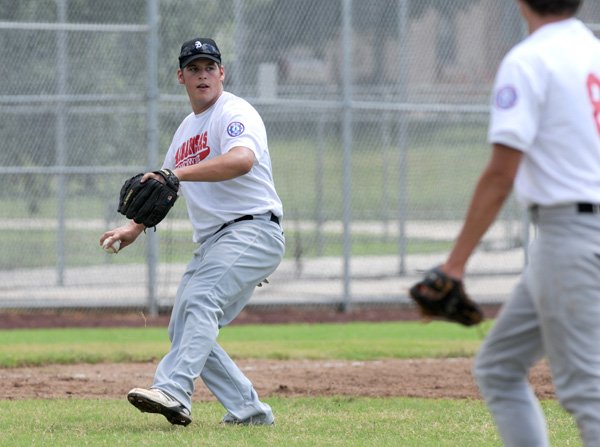 Luke Hulse of the Northwest Arkansas All-Stars, throws out a baserunner July 10 during the North Arkansas Senior Babe Ruth State Tournament at Veterans Park in Rogers.