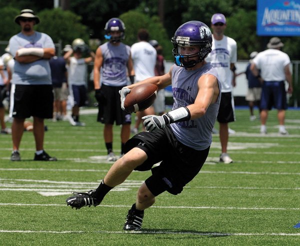 Fayetteville’s Nathan Varady prepares to make a move during a game against Greene County Tech during the Southwest Elite 7-on-7 Showcase on July 10 at Shiloh Christian School in Springdale.