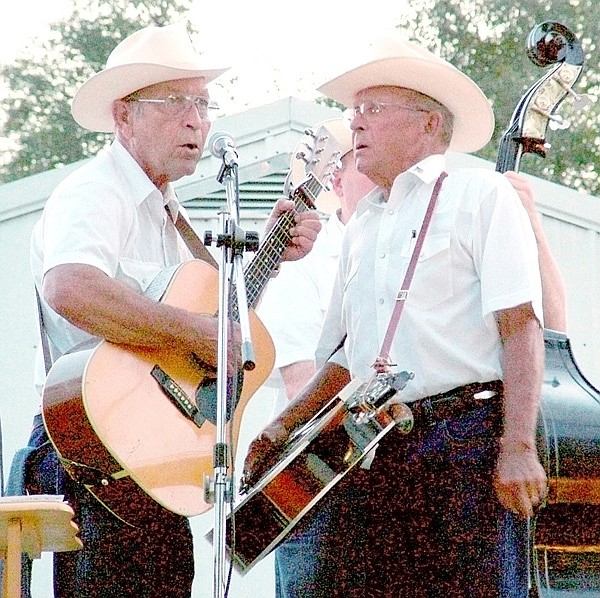 Brothers John and Keith Escue crooned to the crowd as Shady Grove Bluegrass band provided the music Saturday night at the annual Pea Ridge Community Fair. Musicians included Adam Ash, Clyde Gosvener, Brad Fortner, H.K. Scott, John Escue and Keith Escue.