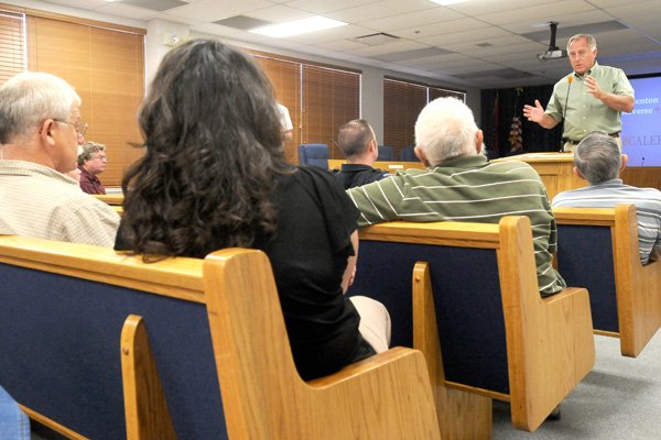 Benton County Judge Dave Bisbee meets with the county’s city mayors on the Benton County telephone emergency notification system. The meeting was held Tuesday at the Benton County Administration Building Courthouse in Bentonville. The system can automatically call, text or e-mail residents in times of civil or weather related emergencies.