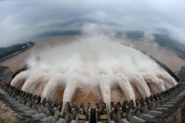 In this photo released by China's Xinhua news agency, flood water is released from the Three Gorges Dam's floodgates in Yichang, in central China's Hubei province, Tuesday.