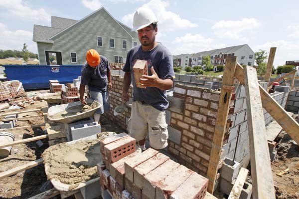 A mason lays brick on a new house in Richmond, Va., earlier this month. Home construction fell in June to the lowest level since October.