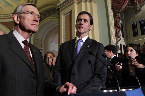 Senate Majority Leader Harry Reid, D-Nev., is joined Tuesday after the vote by freshly sworn-in Sen. Carte Goodwin, D-W.Va., who replaced the late Robert Byrd.