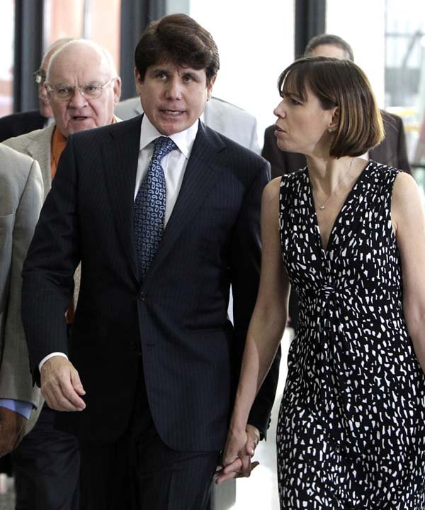 Former Illinois Gov. Rod Blagojevich walks with his wife, Patti, after his attorneys rested the defense’s case during his trial Wednesday in Chicago.