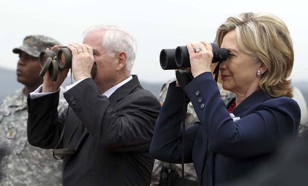Defense Secretary Robert Gates and Secretary of State Hillary Rodham Clinton peer at North Korea from the demilitarized zone in the village of Panmunjom on Wednesday.