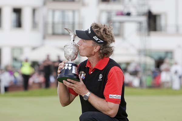 Germany’s Bernhard Langer kisses the winner’s trophy after capturing the Seniors British Open at Carnoustie Golf Club, in Carnoustie, Scotland on Sunday.