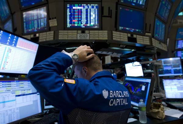 A trader works on the floor of the New York Stock Exchange in New York on Monday.