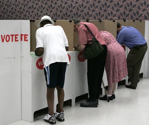 FILE — Early voters fill out their ballots in Oklahoma City, Monday, July 26, 2010. Oklahoma's primary election began Tuesday.