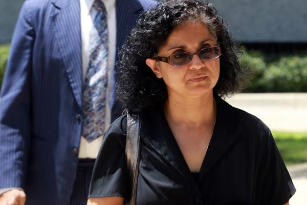 Sangeeta Mann (right), wife of Randeep Mann, not pictured, enters the Federal Courthouse in Little Rock Tuesday. 