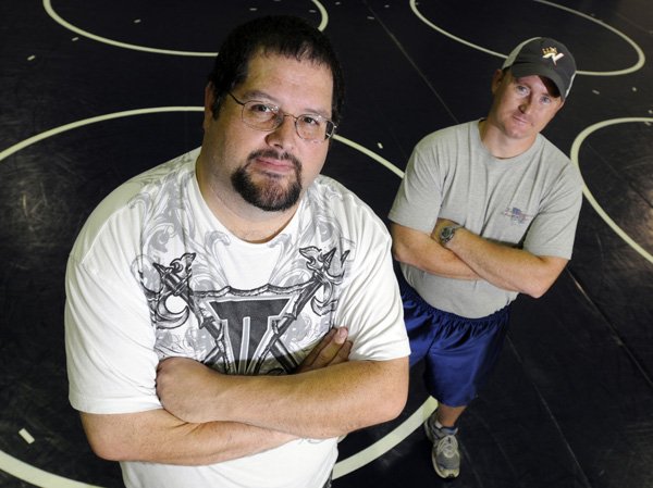 Doug Freeman, left, was recently named Rogers Heritage’s new wrestling coach and Jason Hall is the program’s new assistant coach.