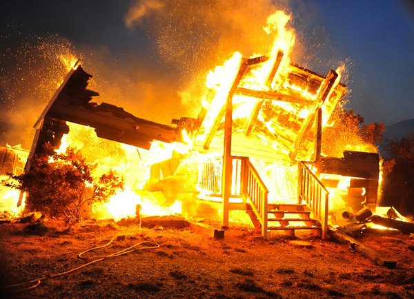 Two wildfires  that erupted Tuesday and spread quickly in Southern California have destroyed dozens of homes including this house about five miles above Highline Road in Tehachapi and forced evacuations in remote areas of the state's Kern County.