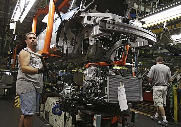 Rob Crump works on a 2011 Chevrolet Cobalt in June at General Motors’ Lordstown Assembly Plant in Lordstown, Ohio.