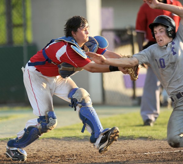 Baytown (Texas) Knights catcher Robert Russell, left, applies the tag to Fayetteville’s Carson Shaddy on Wednesday as Shaddy tries to score in the third inning of their game in the Premier Baseball National Sophomore Championship at Fayetteville High.