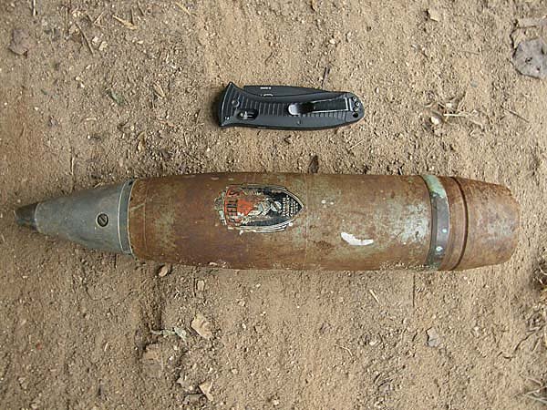 This live 75mm Howitzer round, placed beside a pocketknife for comparison, was found Tuesday at a Benton home just hours after a dummy mortar round was found at another Benton home.
