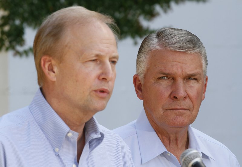 James Lee Witt, right, listens to incoming BP CEO Bob Dudley as he announces Witt's hiring as an adviser to BP's Deepwater Horizon oil spill response in Biloxi, Miss., on Friday, July 30, 2010. 