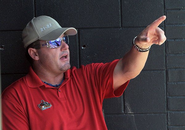  Roger Clemens looks on from the dugout as the Houston Heat play Thursday in the Premier Baseball National Sophomore Championship at Crowder Field on the campus of the University of Arkansas-Fort Smith.
