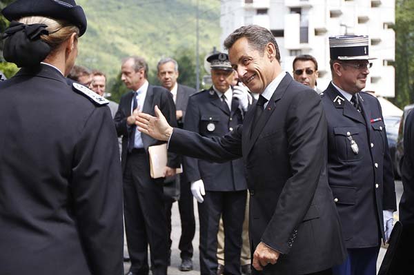 French President Nicolas Sarkozy arrives Friday at a police station in Grenoble in the French Alps.