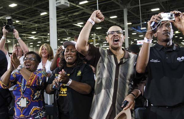 Autoworkers cheer Friday as President Barack Obama speaks at the Jefferson North Chrysler plant in Detroit.