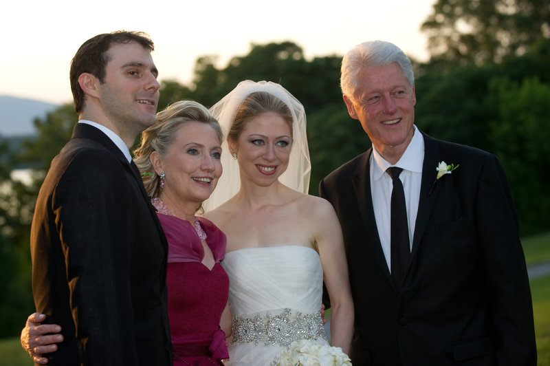 This photo released by Genevieve de Manio Photography shows Marc Mezvinsky,left with his new mother-in-law Hillary Rodham Clinton, his bride Chelsea and father-in-law former President Bill Clinton after the couples wedding Saturday July 31, 2010 in Rhinebeck,N.Y.