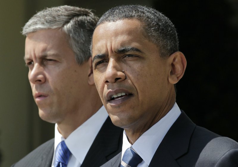 President Barack Obama, accompanied by Education Secretary Education Arne Duncan, gives his support to out-of-work teachers while speaking in the Rose Garden of the White House in Washington, Tuesday, Aug. 10, 2010, to urge the House to pass legislation that could help keep 160,000 educators on the job.