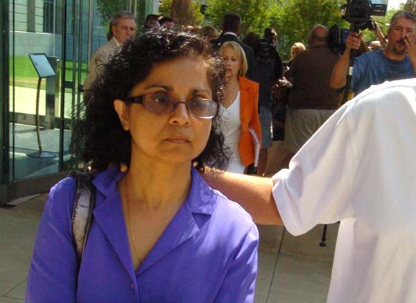  Arkansas Democrat-Gazette/STEVE KEESEE 8/9/10 Sangeeta Mann, wife of Randeep Mann, leaves the Federal Courthouse in Little Rock Monday with an unknown person after she and her husband were found guilty.