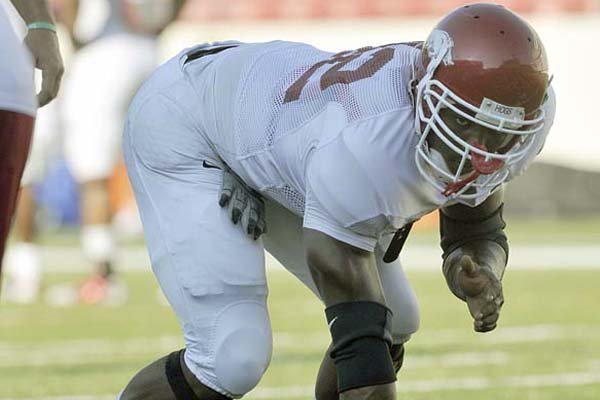 Chris Smith is among the Razorbacks freshmen who are adjusting to Division I football workouts as well as life away from home. Smith, a defensive end who is expected to contribute this season, said, “My mom makes some great pork chops. I’m missing that.”