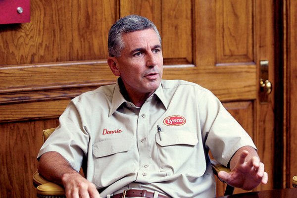 Donnie Smith, president and chief executive officer of Tyson Foods Inc., in his office Wednesday at the Springdale company’s headquarters.