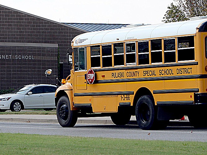 A bus lines up outside Crystal Hill Elementary Magnet School  after 3 pm Monday afternoon.