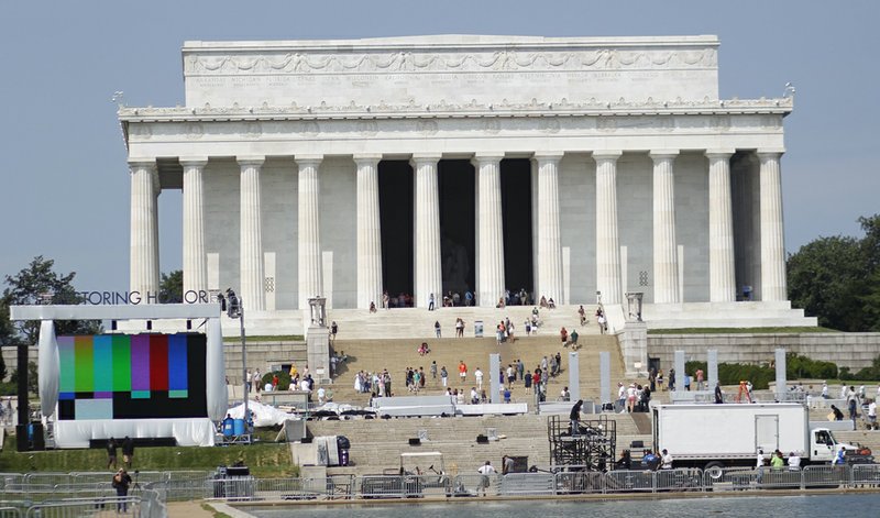  	Work continues at the Reflecting Pool in front of the Lincoln Memorial in preparation for Saturday's Glenn Beck Restoring Honor' rally on the National Mall in Washington, on Thursday, Aug. 26, 2010.
