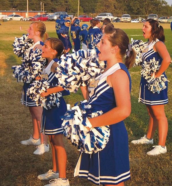Decatur's cheer leading team made their debut at Monday's junior high game against Gentry. Pictured from left are Lindsey Busby, Celine Prelle, Haley Burden and Lanna Fowler.
