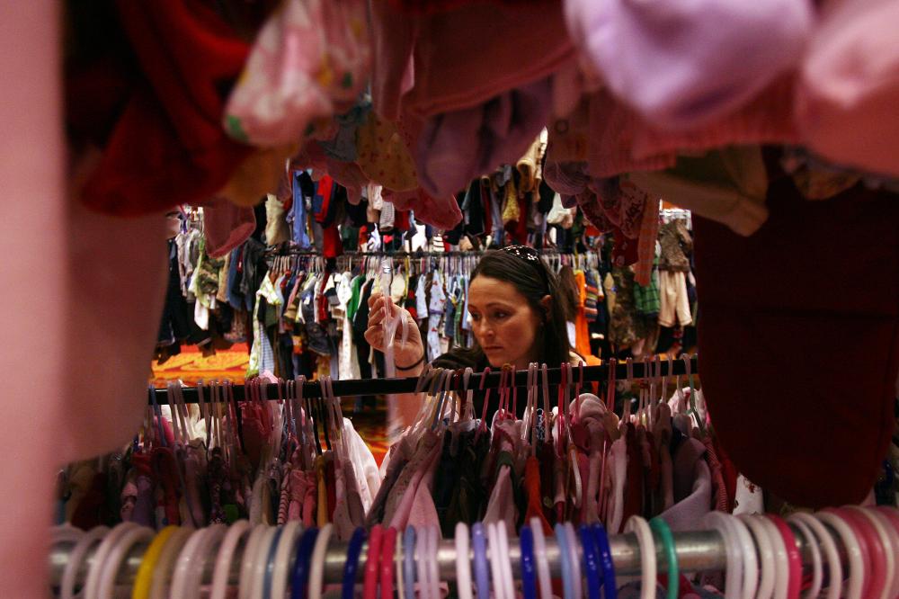 Arkansas Democrat-GazetteWILLIAM MOOREBrandi Garner of Rogers shops for clothing for her two daughters at the annual Rhea Lana's children's consignment sale Thursday, September 2, 2010 at the John Q. Hammons Center in Rogers. The sale features 725 families selling approximately 67,000 items. The sale will continue through the 4th, and there will be another at the Kantz Center in Fayetteville September 28 through October 2.