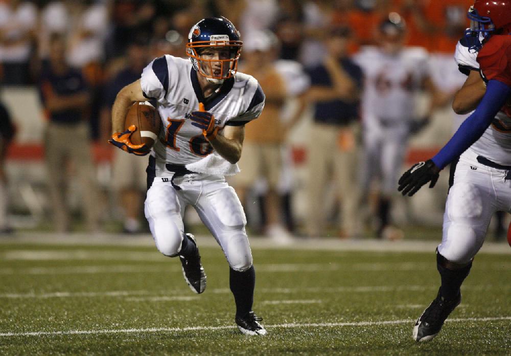 Arkansas Democrat-GazetteRYAN MCGEENEY --09-02-10--Rogers Heritage running back Zach Stewart runs through a hle in the Helena defense during Thursday night's game at Razorback Stadium.