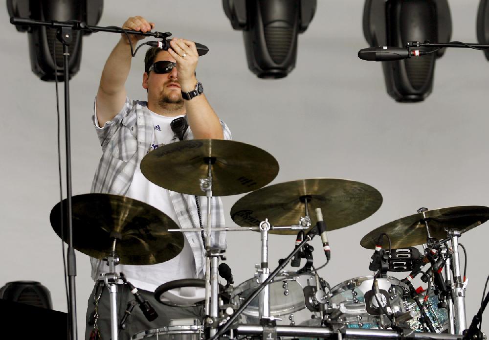 Arkansas Democrat-GazetteJASON IVESTER --090210--Ryan Knutson of Boulder, Colo., adjusts the microphones over the drum set on stage on Thursday, Sept. 2, 2010, at the Arkansas Music Pavilion in Fayetteville. The band, STS9, was scheduled to play a concert later that night.
