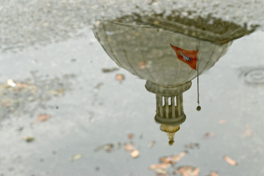 Arkansas Democrat-GazetteKAREN E. SEGRAVE9210The Arkansas State Capitol dome is reflected in a small rain puddle on Thursday afternoon. Light rain fell over most of Little Rock and central Arkansas.