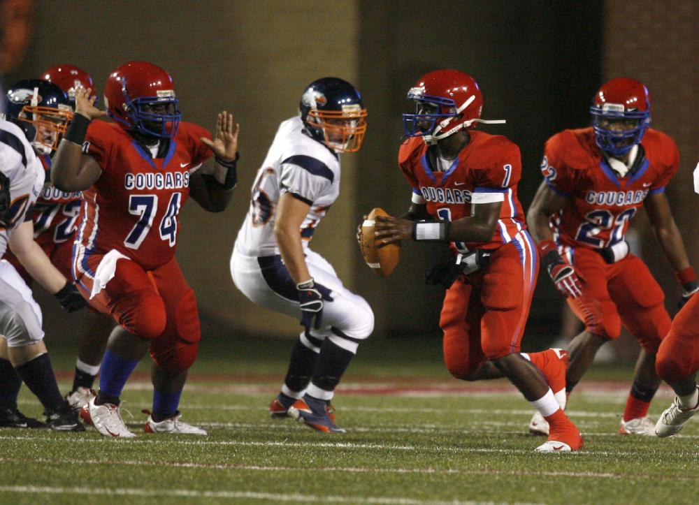 Arkansas Democrat-GazetteRYAN MCGEENEY --09-02-10--Helena quarterback Markeith Jacobs rushes upfield during Thursday night's game againt Rogers Heritage at Razorback Stadium.