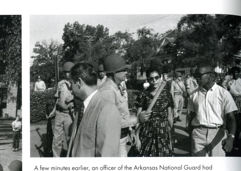 Lt. Col. Marian Johnson uses his baton to block the path of Carlotta Walls and Jefferson Thomas as they walk into Central High School in 1957. Johnson said he was acting under orders from Governor Orval Faubus. Thomas died Sunday. The photo is taken from "A Life is More than a Moment - The Desegregation of Little Rock Central High" by Will Counts.