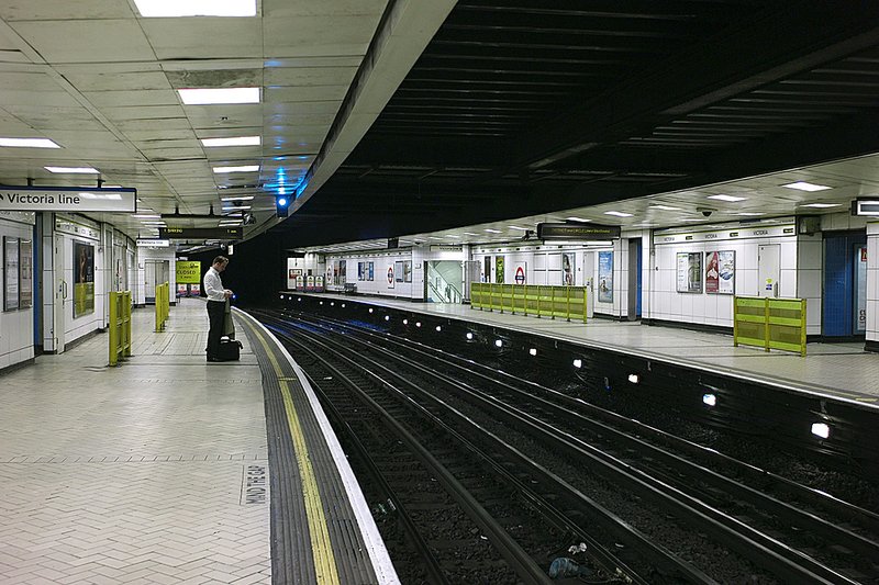 A lone commuter waits Tuesday on an empty platform in the strike-closed Victoria underground station in London.