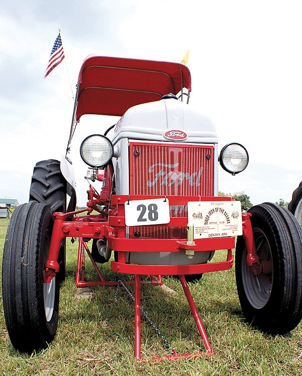 Tractors are lining up at the show grounds of the Tired Iron of the Ozarks antique engine and tractor show scheduled for this weekend. The show features tractors, engines, farm equipment, a blacksmith shop, saw mill and other equipment used in years gone by.