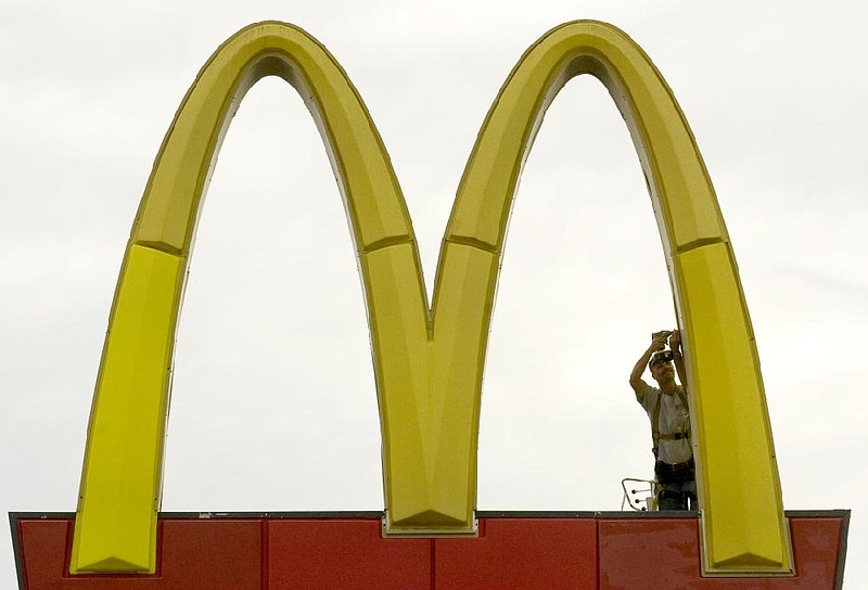 Arkansas Democrat-GazetteKAREN E. SEGRAVE91410Paul Brewer with Skylite (cq) Sign & Neon works to replace a panel on the lower section of the golden arches outside McDonald's located at the intersection of JFK and North Hills Blvd., in Sherwood on Tuesday afternoon.