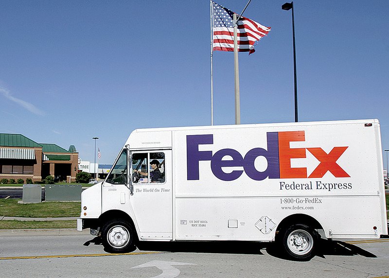 FedEx earned $380 million in the first quarter, but its freight unit lost $16 million, the company reported.
